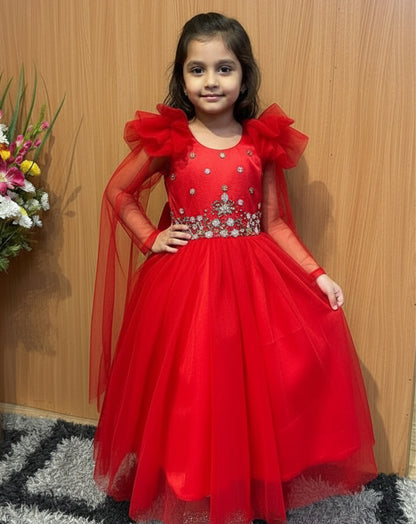 Ignite your baby's wardrobe with the Hemqueen Babybliss Red Tulle Gown, a stunning masterpiece featuring ruffled shoulders, shimmering embellishments, and flowing sheer sleeves that twirl like a dream. This bold crimson gown is perfect for parties, weddings, or special moments, making every little girl feel like royalty.

Crafted with premium tulle for a lightweight, ethereal look, it combines comfort and elegance for all-day wear. Limited stock available—order now at hemqueen.com and tag a mom who needs th