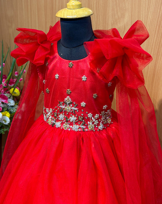 Ignite your baby's wardrobe with the Hemqueen Babybliss Red Tulle Gown, a stunning masterpiece featuring ruffled shoulders, shimmering embellishments, and flowing sheer sleeves that twirl like a dream. This bold crimson gown is perfect for parties, weddings, or special moments, making every little girl feel like royalty.

Crafted with premium tulle for a lightweight, ethereal look, it combines comfort and elegance for all-day wear. Limited stock available—order now at hemqueen.com and tag a mom who needs th