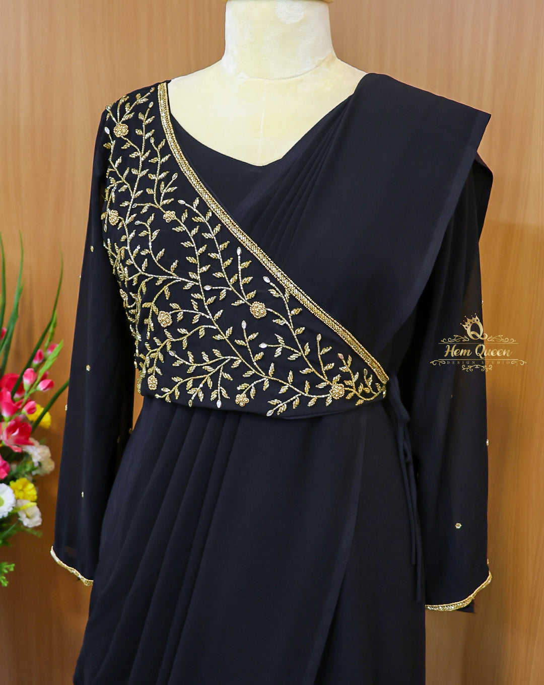 This Overlapping Draped Maxi Dress is a stunning blend of modern elegance and traditional charm. Crafted from rich, flowy fabric, the gown features a unique overlapping drape, full-length sleeves, and delicate gold embroidery that adds a touch of royalty. Perfect for evening parties, festive gatherings, or formal occasions.

Designed for women who want to make a graceful yet bold statement.

Highlights:

Elegant black shade with golden embroidery

Overlapping draped silhouette for a flattering fit

